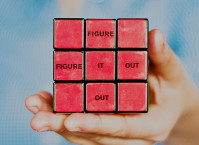 A rubik's cube that reads: figure it out